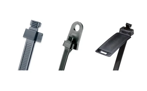 Three black Panduit Sta-Strap cable ties with different head forms on white background