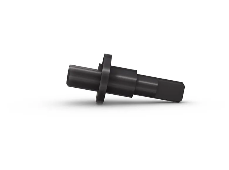 A black turned part, lying on white background